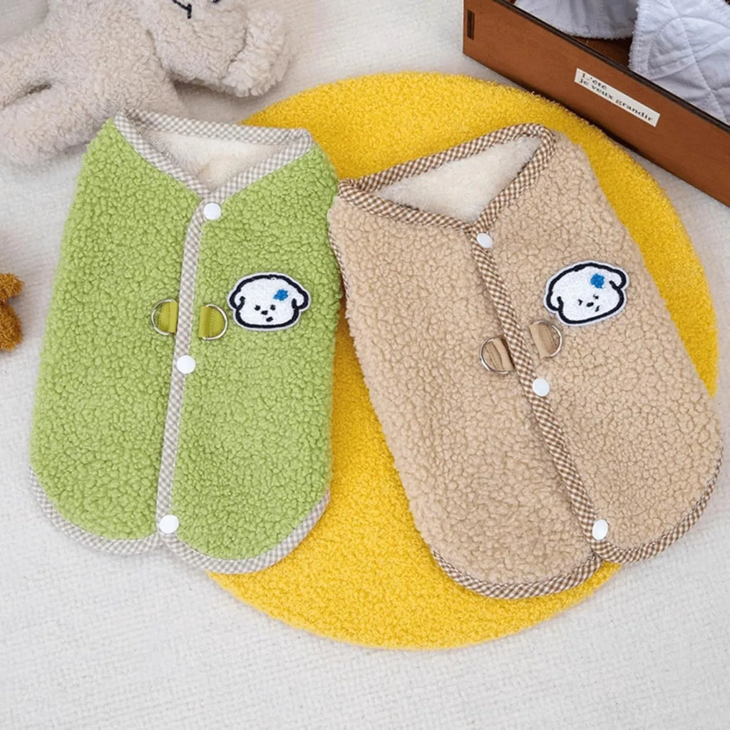Green thickened coral fleece dog vest with a metal leash ring on the back, laid flat.