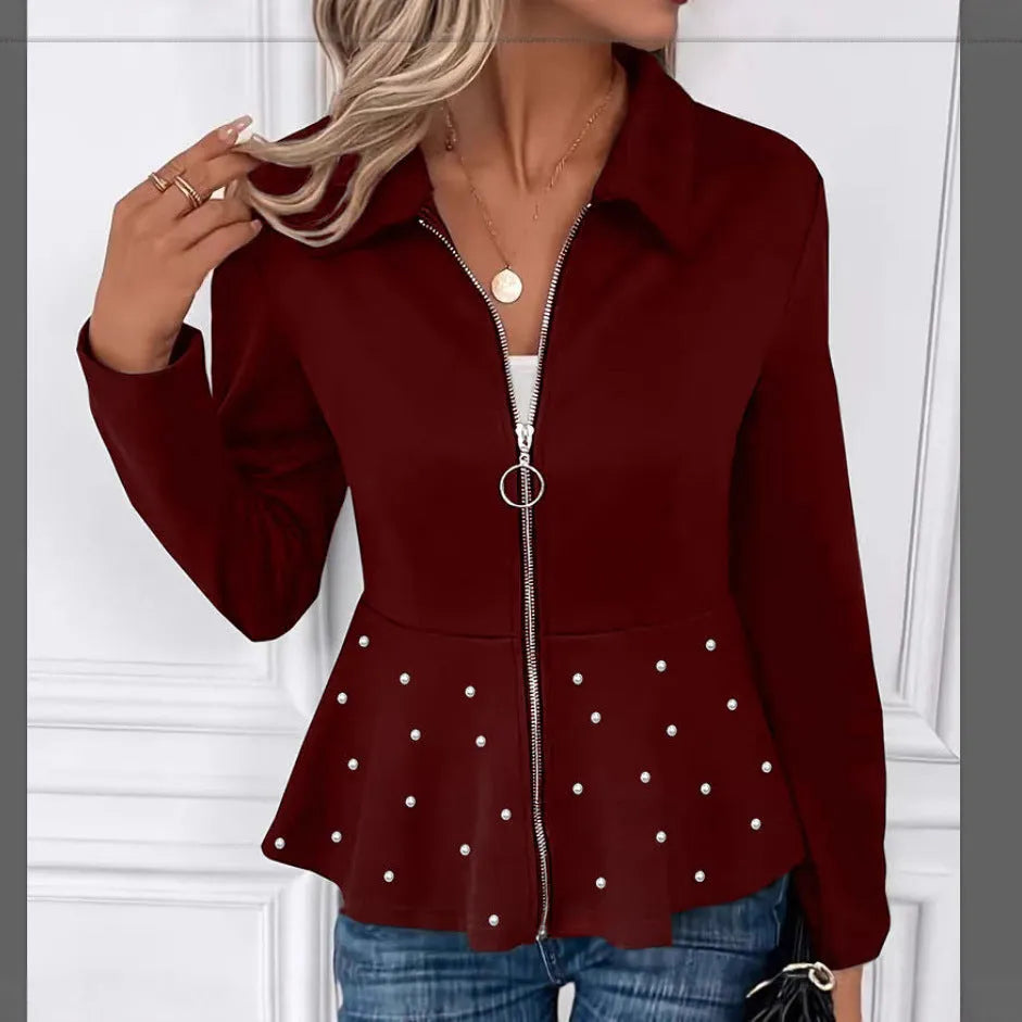 Women's loose black coat with heavy-duty zipper and ruffled hem, shown on a hanger