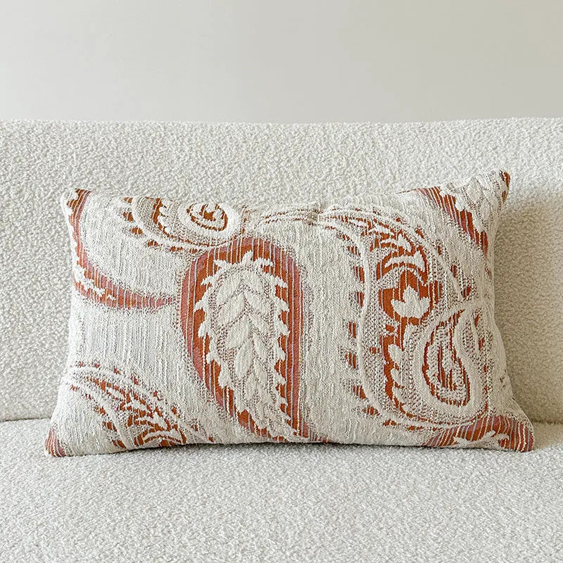 American-style jacquard throw pillow cover with paisley pattern in amber tones, shown in square and rectangular sizes.