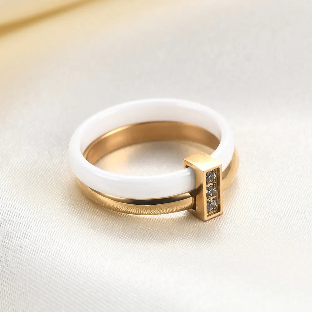 Ceramic geometric women's ring with glossy stitching and zirconium elements in steel black colour