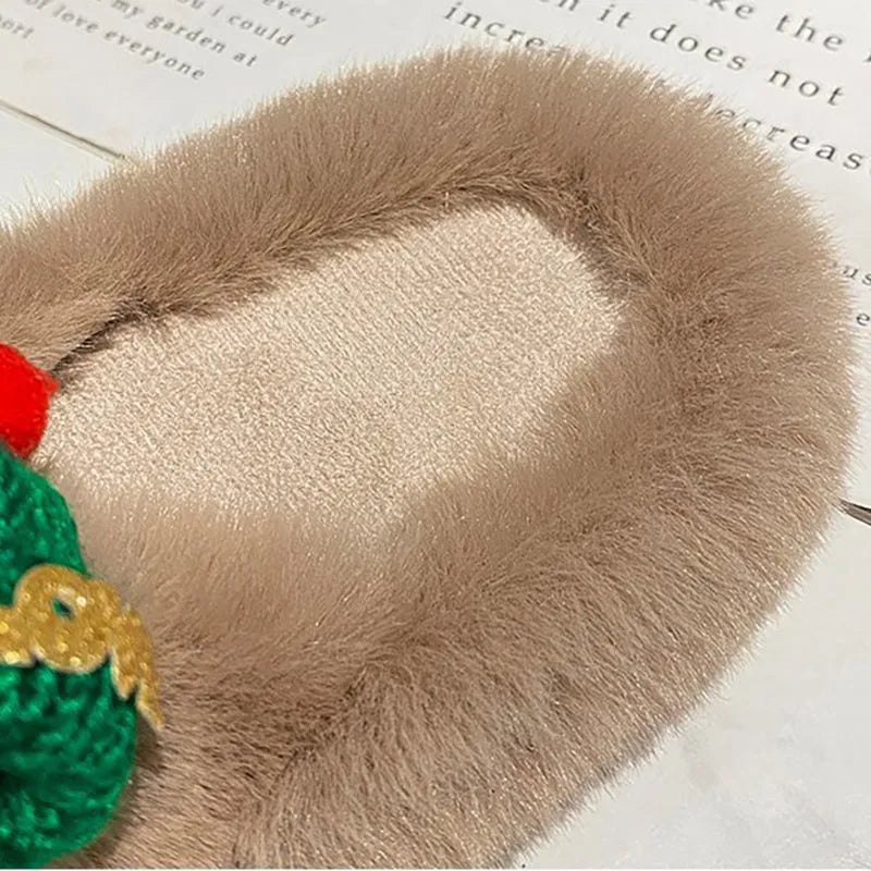 Black Christmas hat design women's slippers with faux plush upper and rubber sole.