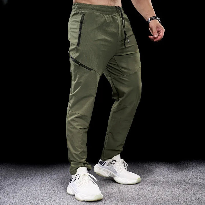 Men's waterproof quick-drying nylon workout pants in Army Green colour, showing mid waist design and trousers length