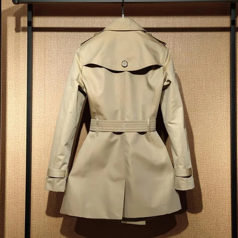 Khaki double-breasted women's trench coat with long flight sleeves and button front.