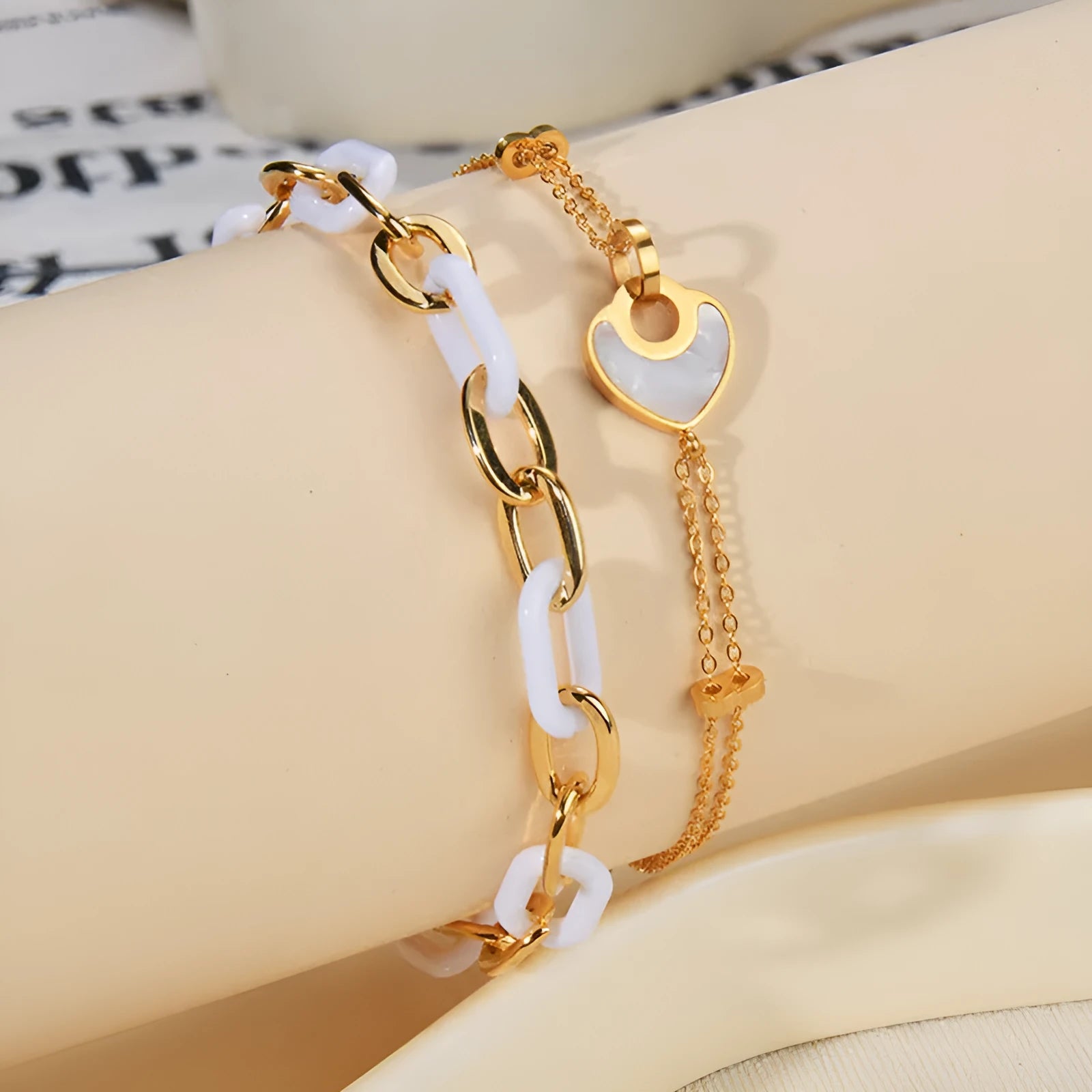 Double-layer heart-shaped stainless steel resin bracelet for women with electroplated finish.