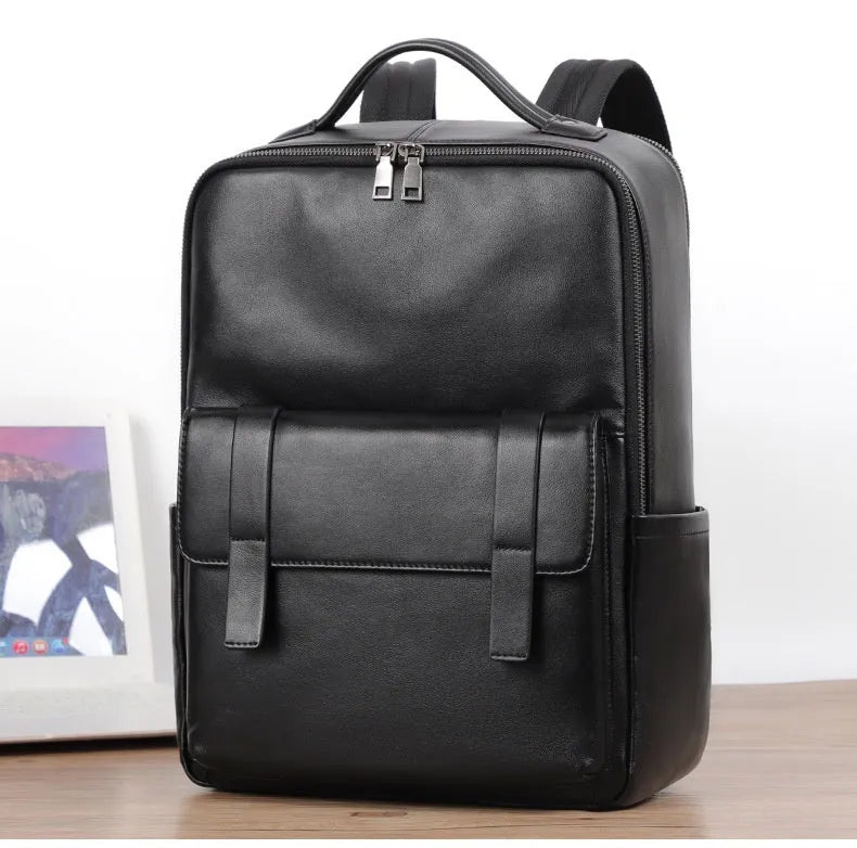 Men's large black leather computer backpack with 36-55L capacity for business and travel