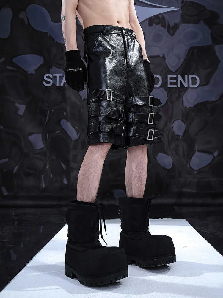 Men's black PU leather cropped shorts with medium-low waist design and leather ring detailing