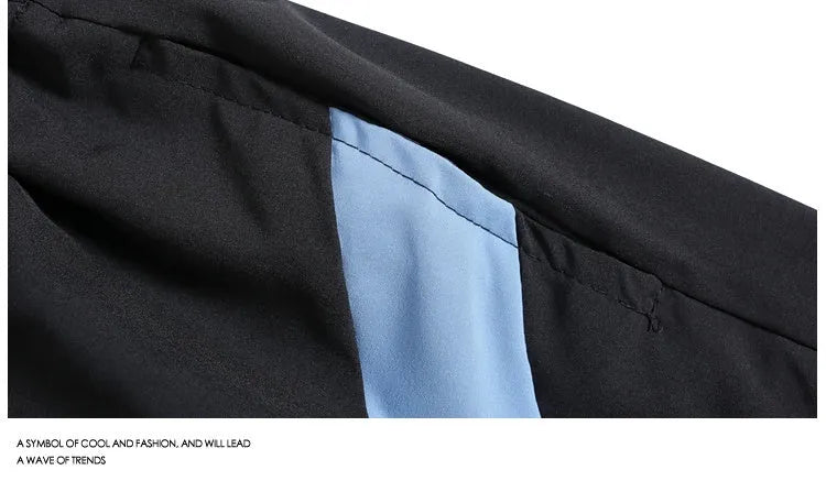 Men's loose fit quick-drying sports shorts in grey with elastic waist, shown above the knee.