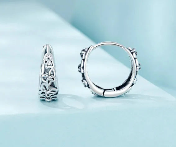 Sterling silver hollow butterfly earrings with zircon accents and retro animal modelling design