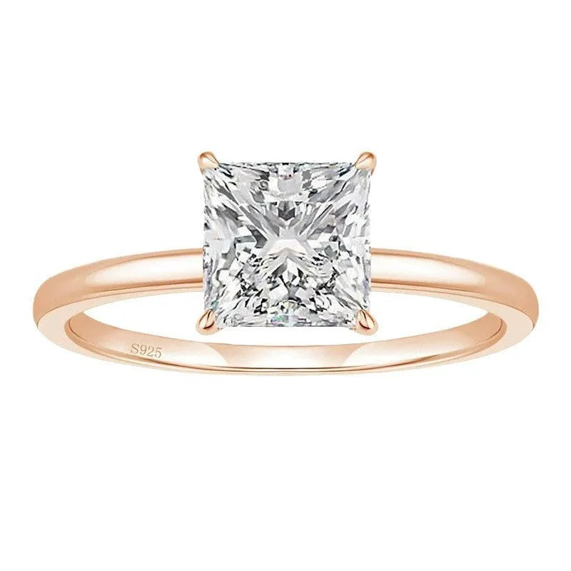 925 sterling silver geometric ring with round detail in silver, gold, and rose gold colours on a white background.