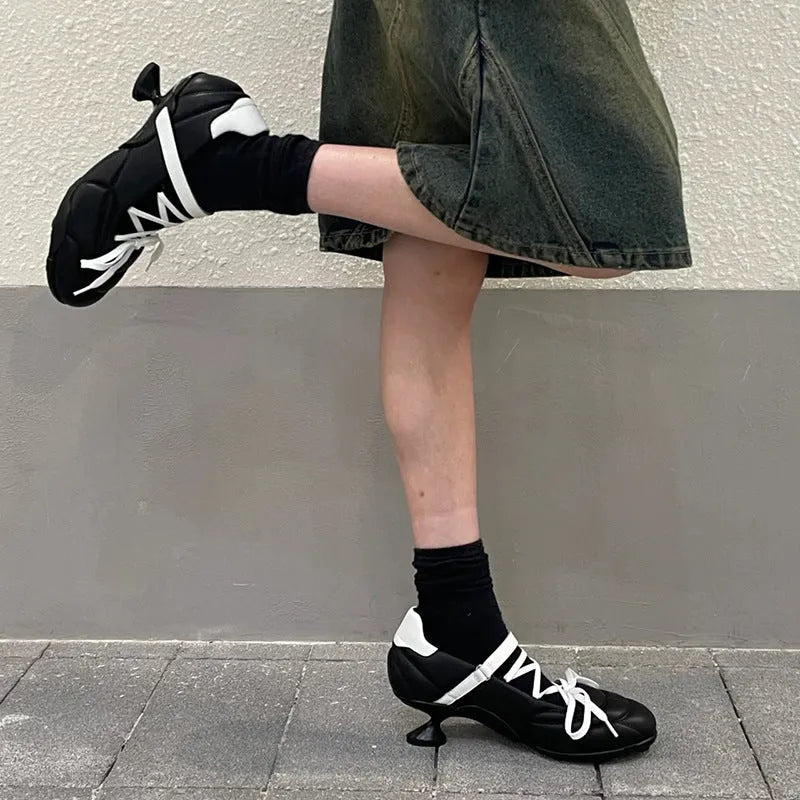 Women's silver lace-up bow sports shoes with round toe and low-top design on a white background.