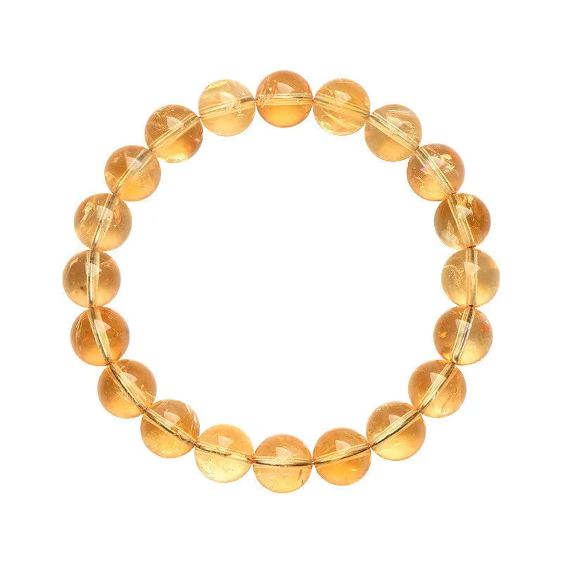 Natural yellow citrine gemstone bracelet showing geometric cut beads on a string.
