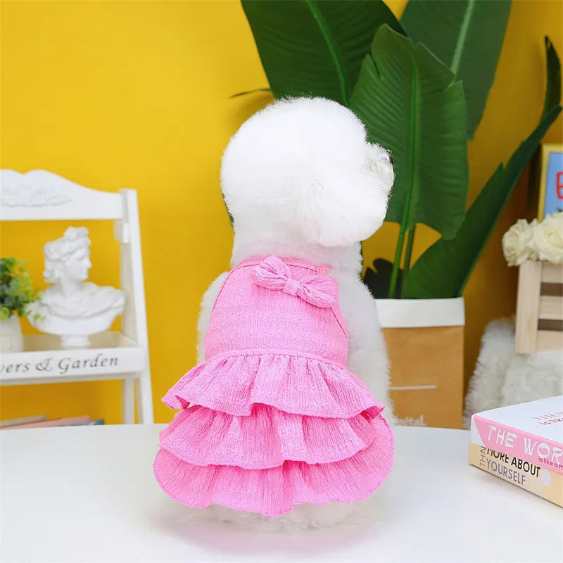 Small dog wearing polyester princess dress with layered candy skirt in rose red colour