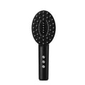 KD3802 Black scalp massage device with host unit and charging cable on a white background