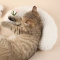 Blue U-shaped cat pillow with neck support design next to yellow question mark pet pillow