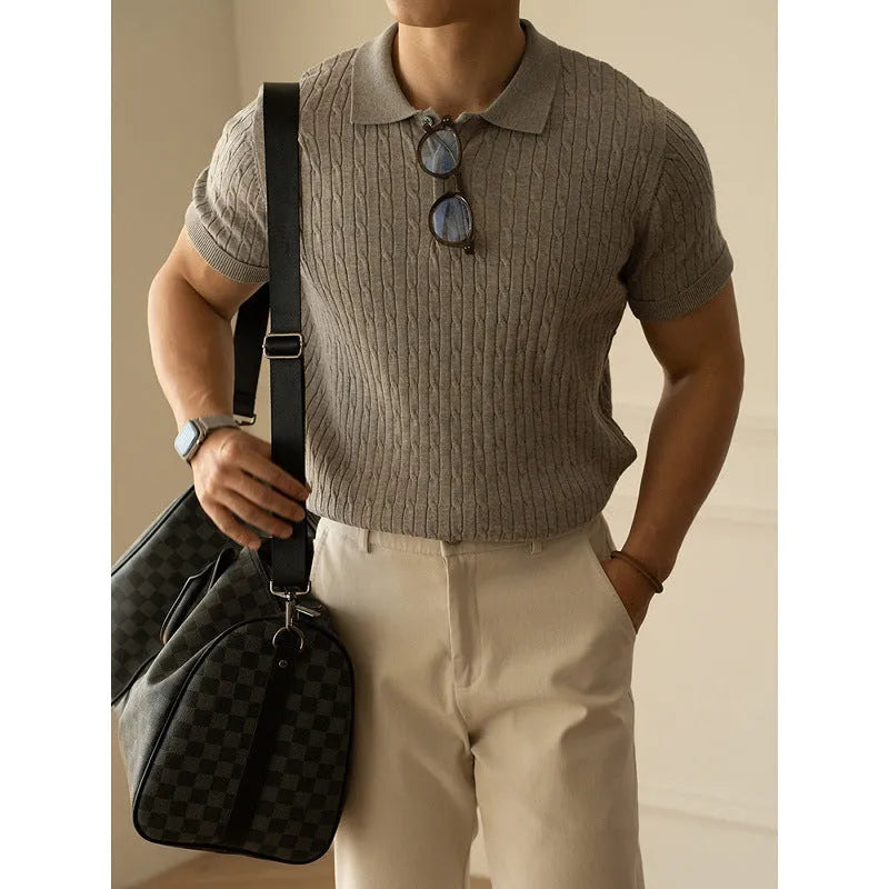 Men's khaki short-sleeve business top on a hanger.