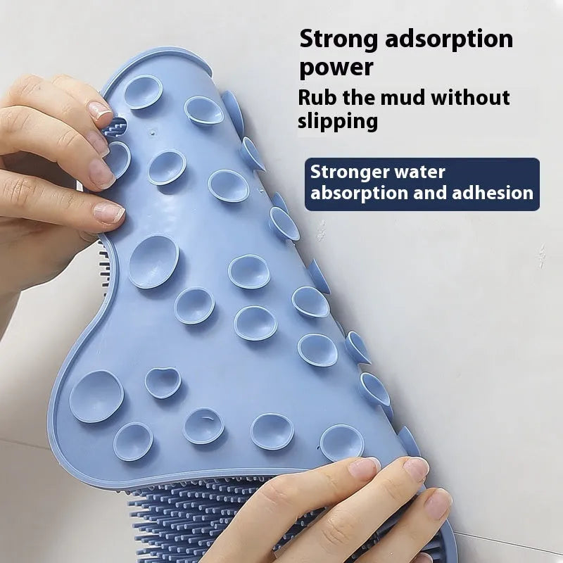 Blue silicone bath massage cushion mat for body scrubbing, shown on a bathroom surface.