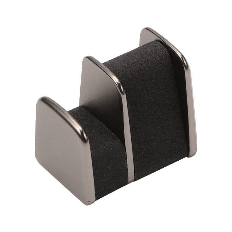 Zinc alloy and leather car dashboard clip for holding glasses, shown in grey.