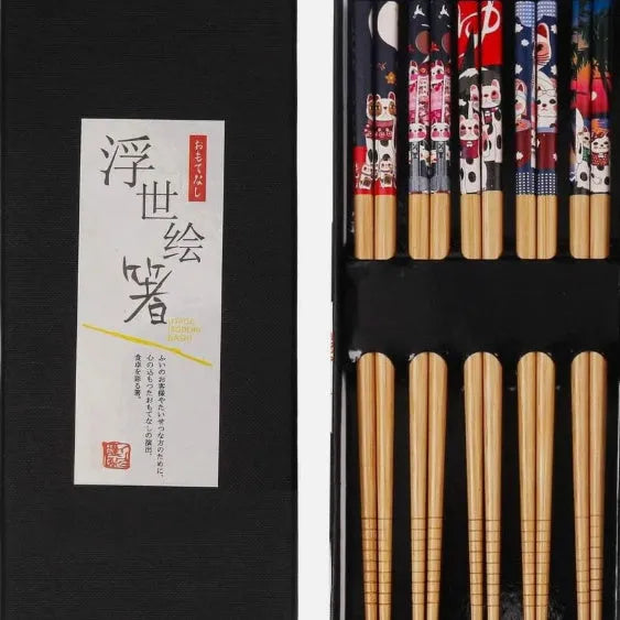 Set of five pairs of bamboo chopsticks with Japanese cartoon pattern in a gift box.