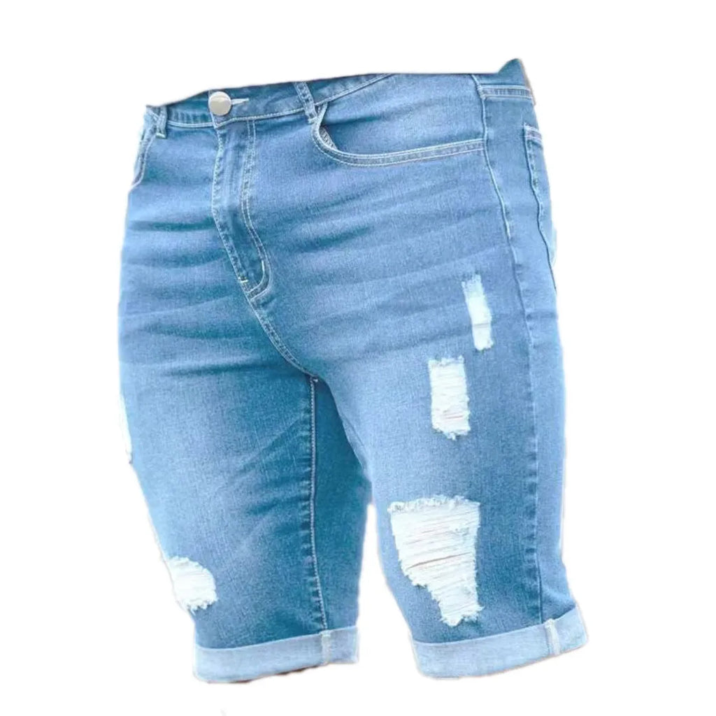 Sky blue distressed denim shorts with multi-hole design and low waist straight leg cut