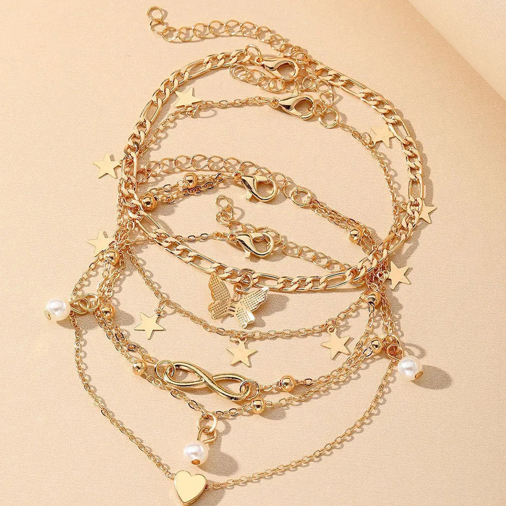 Women's 4-piece anklet set with butterfly, pearl and heart charms in alloy
