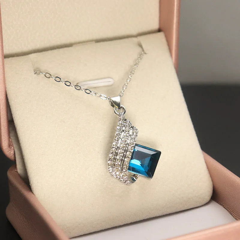 Women's alloy and glass cross chain necklace with matching electroplated stud earrings jewellery set