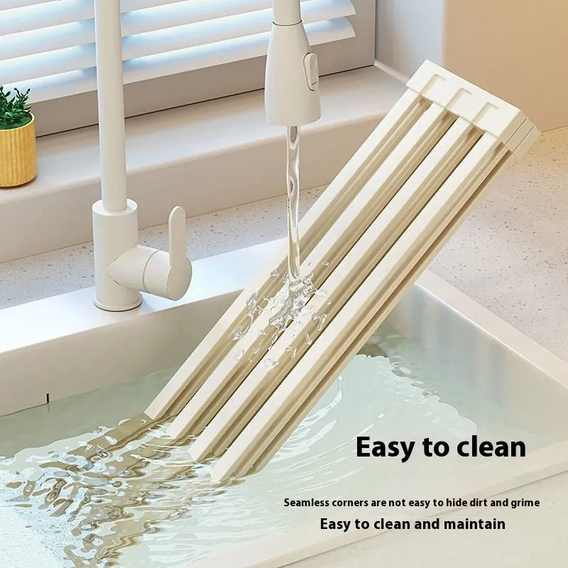 Milky white tri-fold stainless steel kitchen draining rack shown extended for use and folded for storage