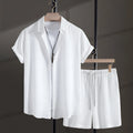 Men's loose fit cotton blend short sleeve shirt and shorts set in white, laid out flat.