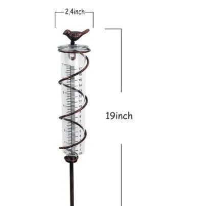 Cast iron hummingbird garden rain gauge with glass measurement tube showing 1-20 scale
