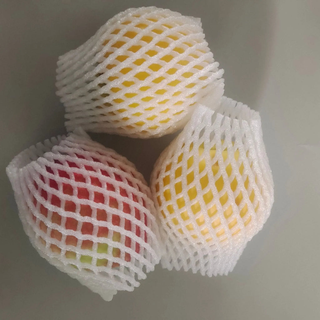 White foam net covers for fruit protection in multiple sizes on various fruits