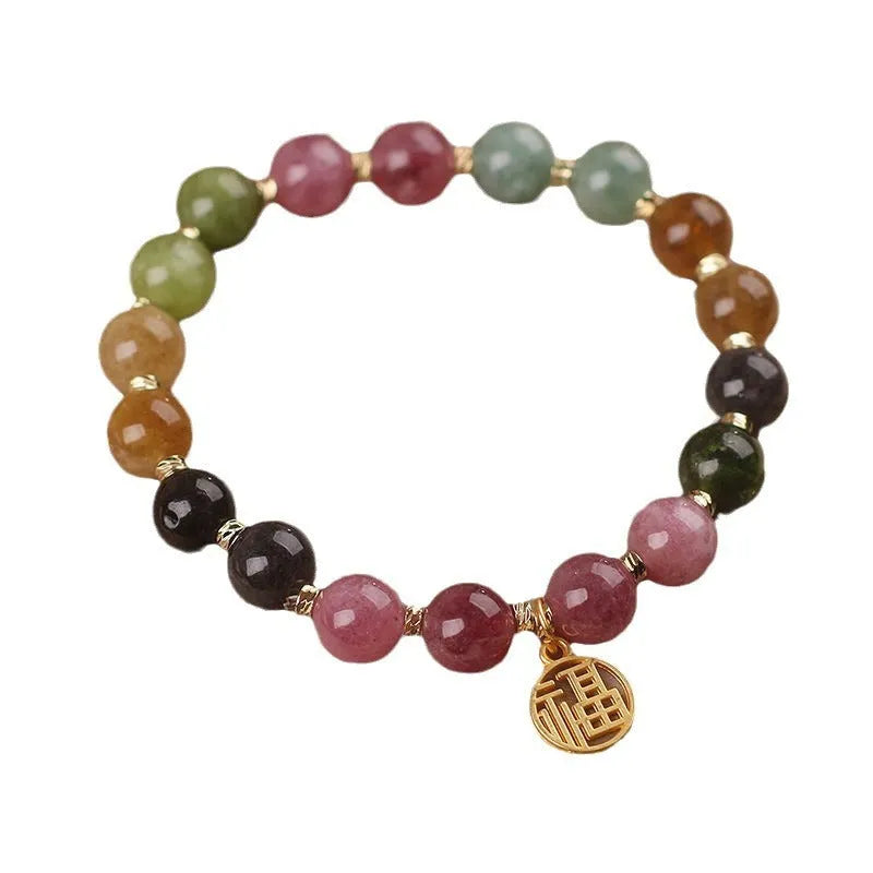 Natural colour tourmaline bracelet with floral and fu character designs on geometric casual jewellery