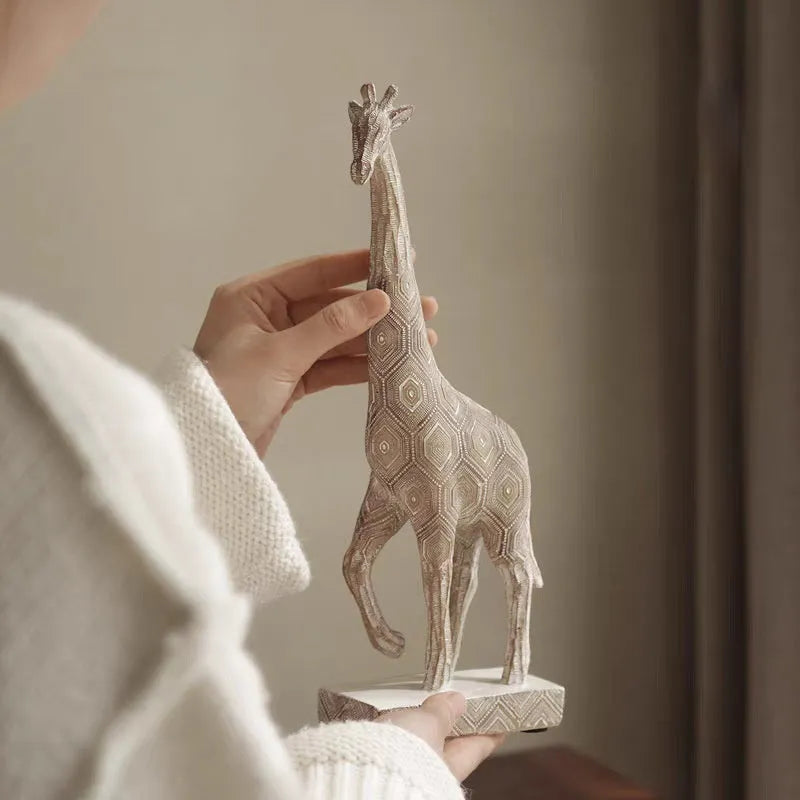 Wood-coloured synthetic resin giraffe ornament for home decoration.