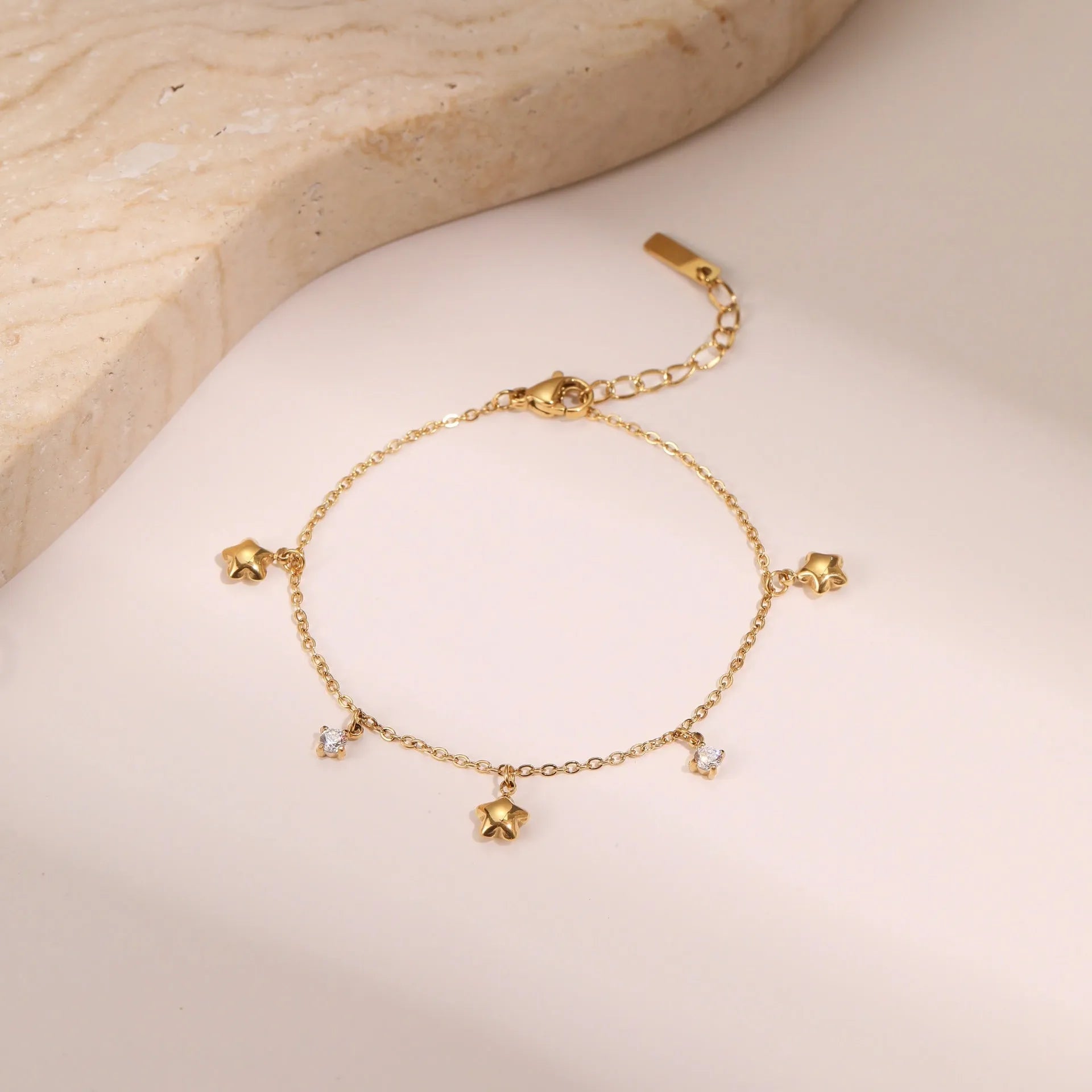 Women's stainless steel bracelet with 18K gold plating and geometric hexagonal zircon star pendant