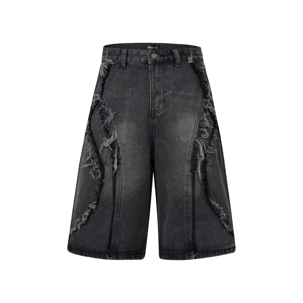 Distressed raw edge denim shorts in straight leg cropped fit.
