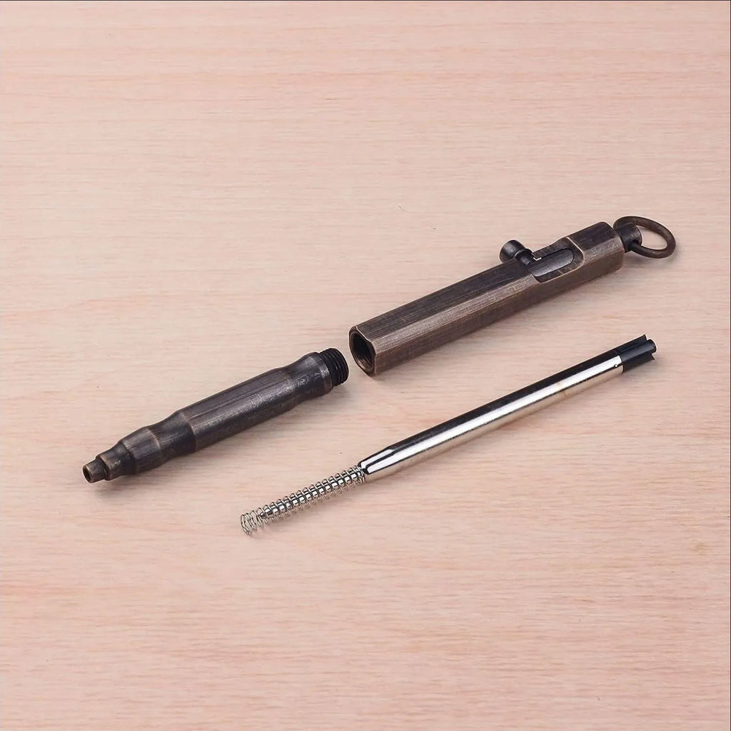 Brass machine gun tactical pen with hexagonal bolt design measuring 13cm in length