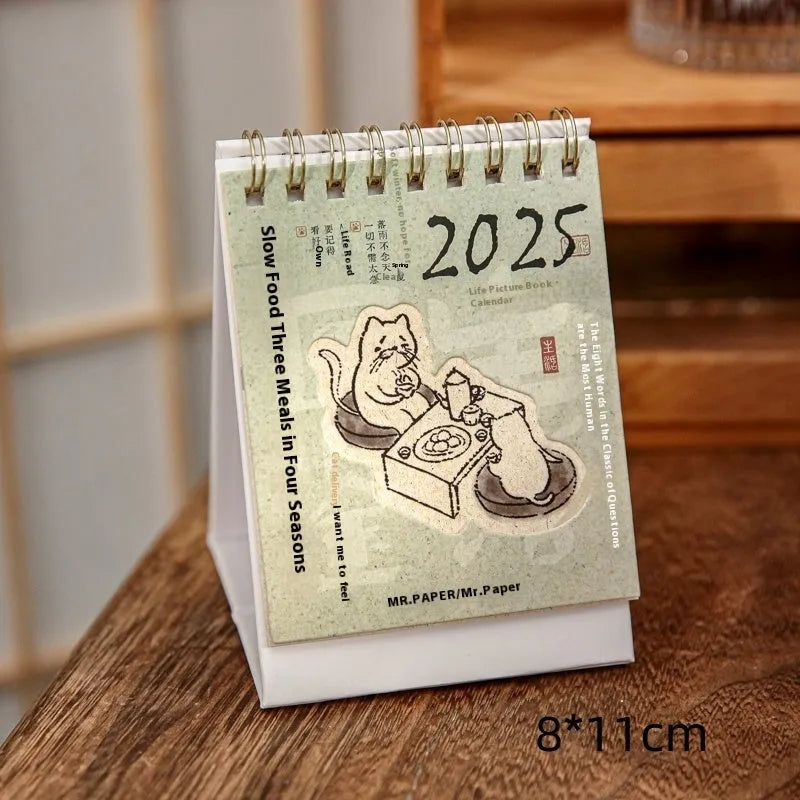 Mini 2025 desk calendar showing multiple design options including Coffee Time and Life Is Not Easy themes