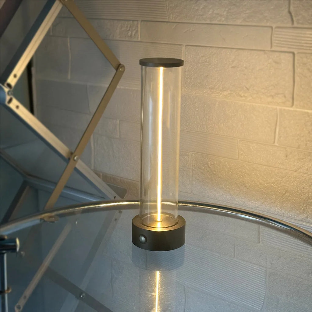 Modern rectangular LED light strip with frosted glass panel, shown with USB cable for charging.