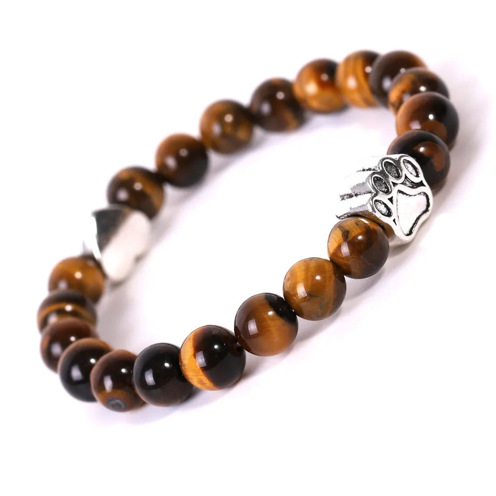 Tiger's Eye and Indian Agate stone beaded bracelet with a dog's paw charm on a white background.