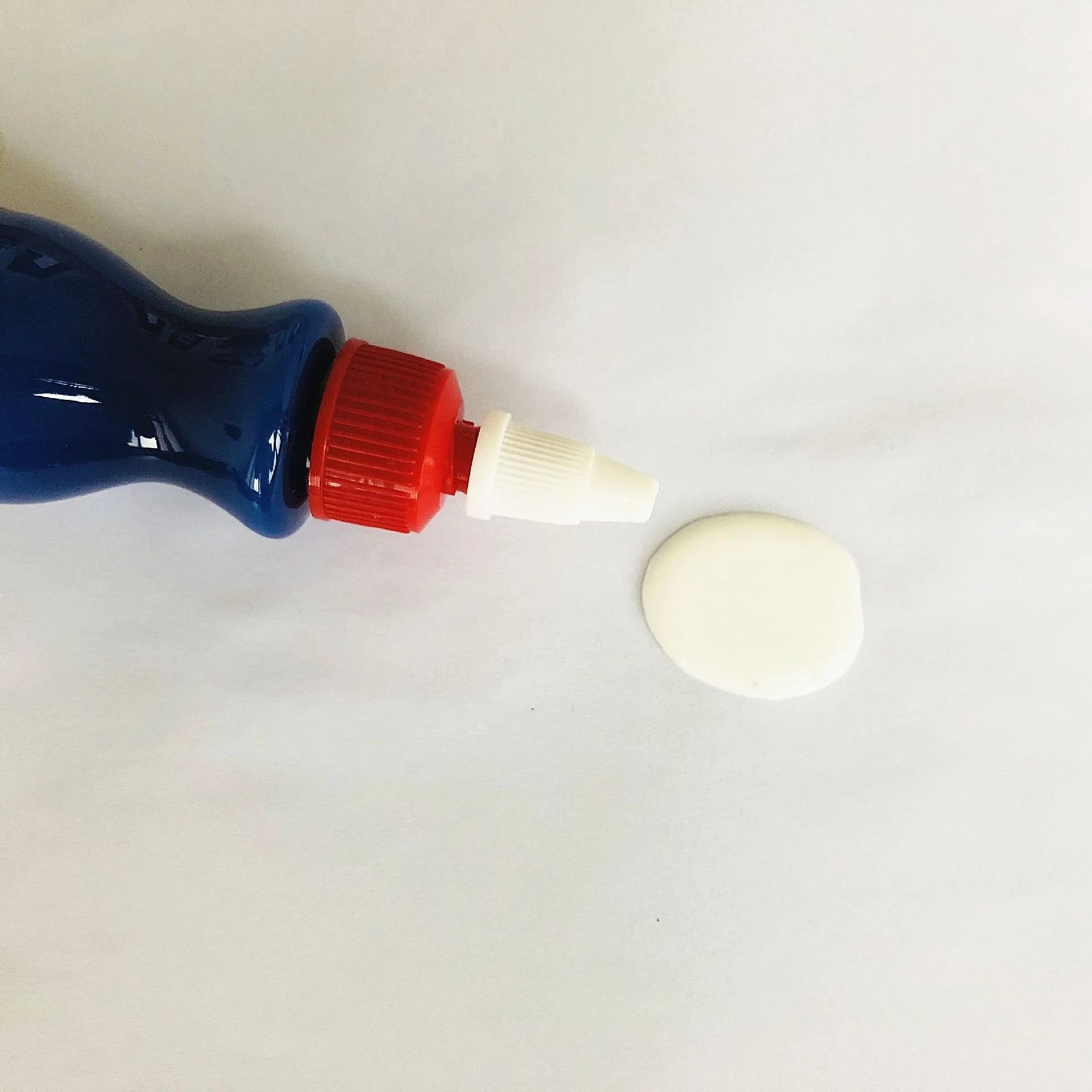 Small blue car wiping tool with scratch repair agent bottle for automotive paint touch-ups