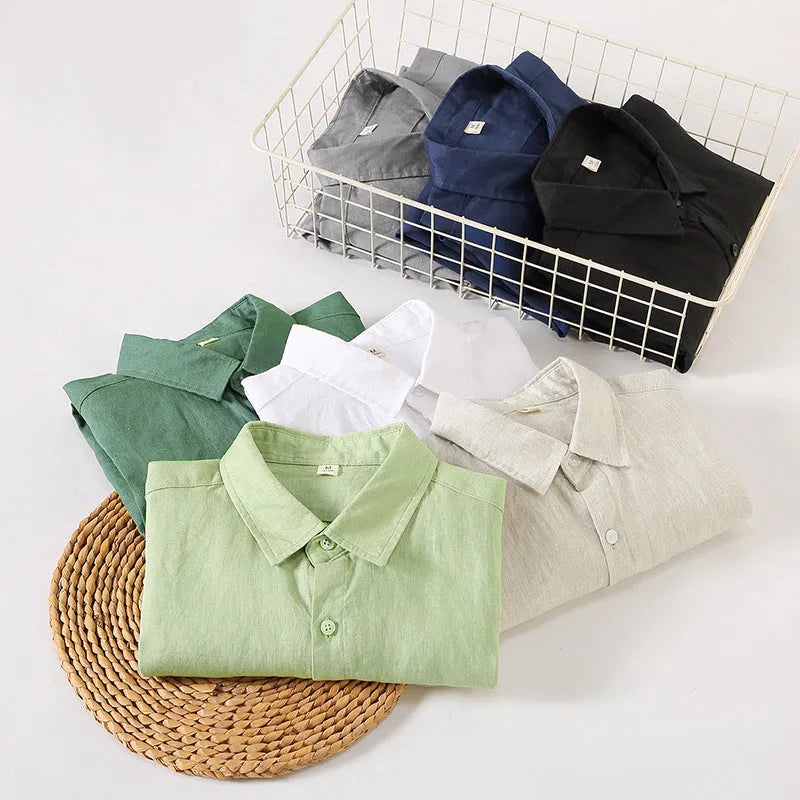 Linen long sleeve loose fit shirt in light green colour, shown on a hanger.