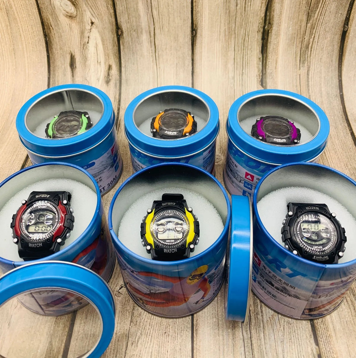 Children's digital sports watch with silicone strap showing time, alarm, and calendar on display.