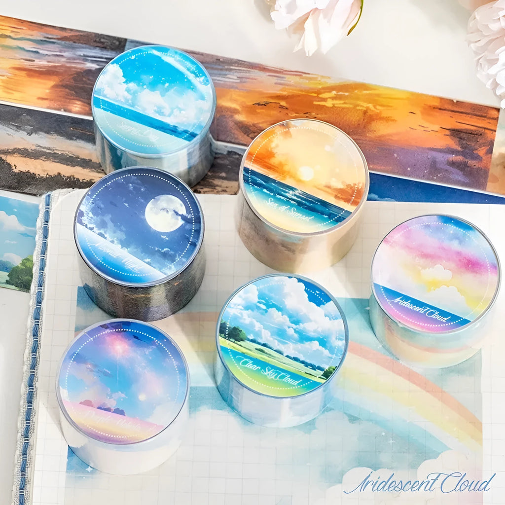Japanese paper washi tape roll with sky theme designs including clouds, sun, twilight, moon, and nebula