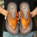Men's dark blue herringbone pattern outdoor slippers with a leather lining and rubber sole.
