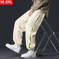 Men's loose-fit ankle banded cotton trousers with stitching detailing and skinny leg opening in grey green colour