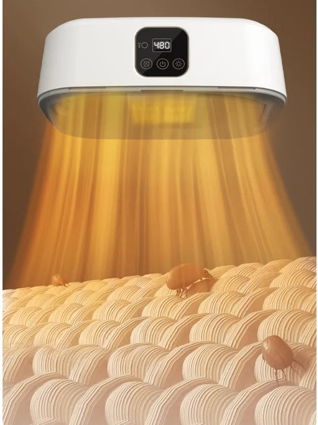 White cylindrical compact laundry dryer with remote control on countertop