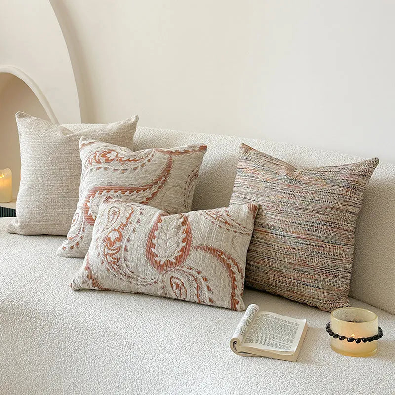 American-style jacquard throw pillow cover with paisley pattern in amber tones, shown in square and rectangular sizes.