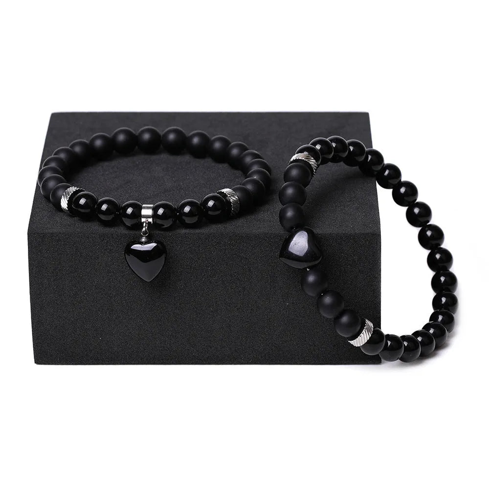 Polished natural stone couple heart bracelets in obsidian, agate, tigereye, crystal, aventurine, topaz, opal colours.