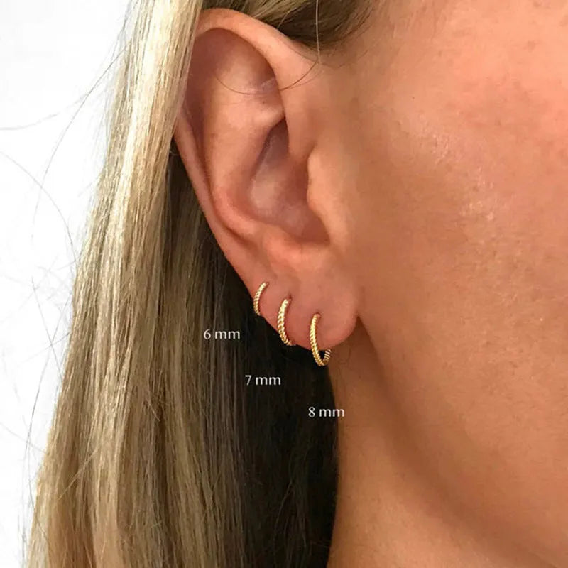 S925 sterling silver twisted string round ring earrings in gold or white gold finish.