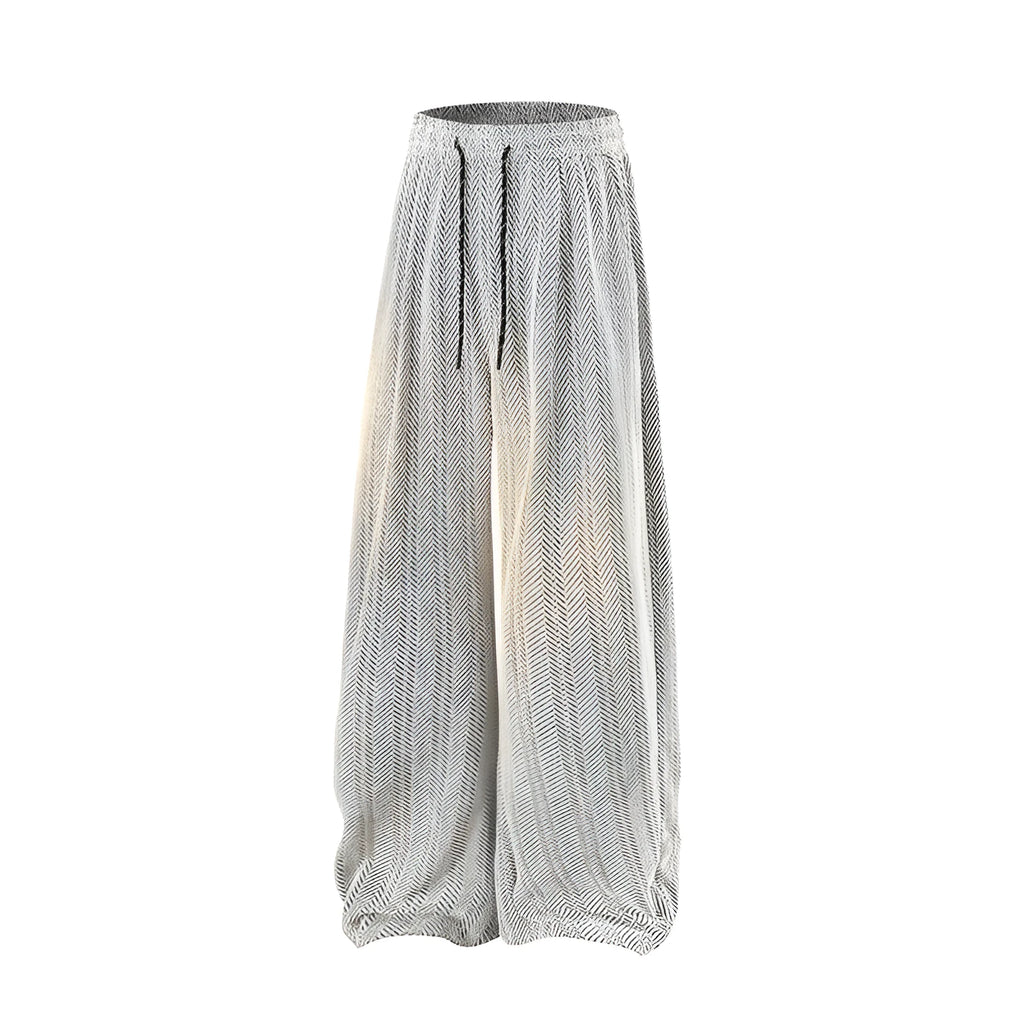 Man's straight-leg fleece-lined trousers in black with an elastic waistband, showing hollow-out fabric texture.