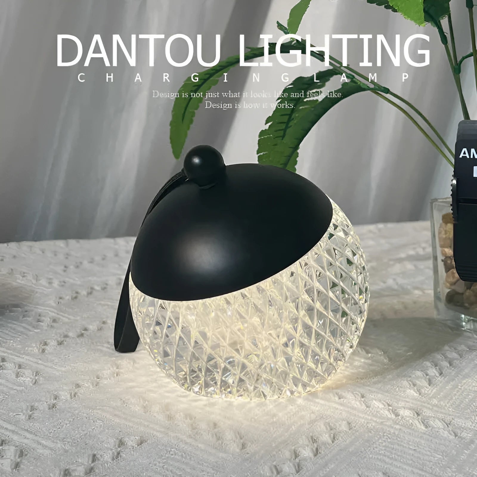 Small round touch-control dimmable LED night lamp in a metallic finish on a wooden table.