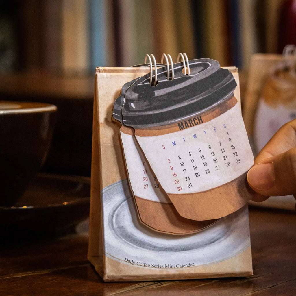Mini 2025 desk calendar showing multiple design options including Coffee Time and Life Is Not Easy themes